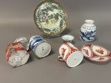 many different types of china cups and saucers on the table