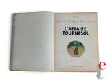 an open book with a picture of a man walking down a path