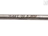 a metal pipe with writing on it on a white surface