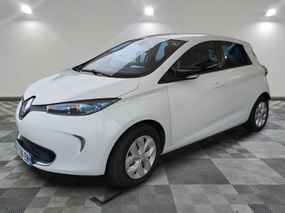 a picture of a white car parked in a garage