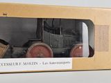 a box with a toy truck in it on a table