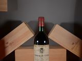 a bottle of wine that is sitting on a table
