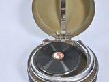 an old record player sitting on top of a table