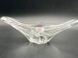 a clear glass bowl with a red label on it