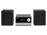 un gros plan d'une chaîne hi-fi avec des enceintes sur fond blanc