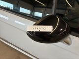 a sticker on the side mirror of a white car