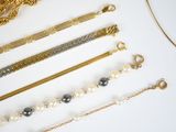 a lot of different types of bracelets on the table