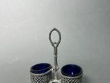 pair of silver plated cups with handles and handles