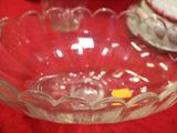 a glass bowl that is sitting on a red table