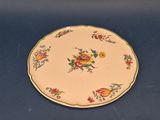 a plate with flowers on it sitting on a table