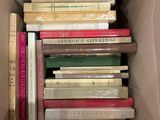 a box full of books that are sitting on a table