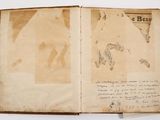 an old book with a map of the world inside of it