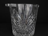 an image of a glass vase with a handle on a black background