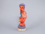figurine of a woman holding a baby in her arms