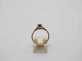 a close up of a ring on a white surface