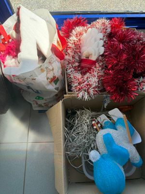a box full of stuffed animals sitting on the floor