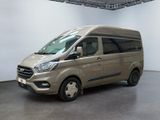 the van is parked in a large room with a white wall