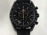 a close up of a watch with a black face and yellow hands