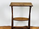 an image of a small wooden table on a parquet floor