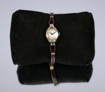 a close up of a wrist watch on a black bag