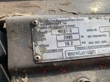 a close up of a metal plate on the back of a vehicle