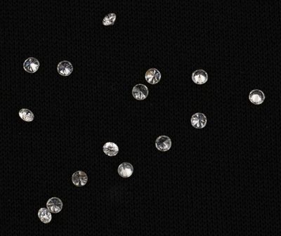 black background with a lot of diamonds falling from the sky
