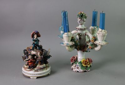 two figurines sitting next to each other on a table