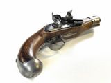 an old gun that is sitting on top of a table