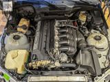 the engine of a car with its hood open and the hood down
