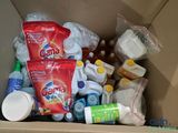 a cardboard box filled with different types of cleaning products