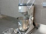 a mixer on the counter in a commercial kitchen