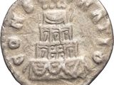 a close up of a coin with a crown on it