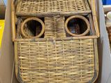 a cardboard box with a wicker face inside of it