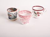 three different types of coffee cups sitting on top of a white table
