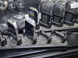 many cell phones that are sitting on a table