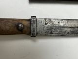 a knife that is laying on a table