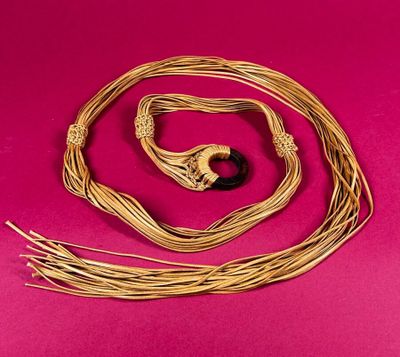 a close up of a rope with a black bead on it