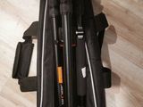 a bag with a camera and a tripod in it on the floor