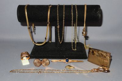 a lot of gold jewelry on display on the table