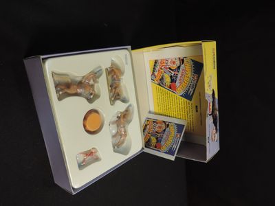 an open box with some toys in it on a table