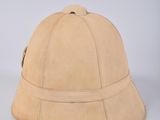 pair of tan leather hats on a white background