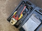 a tool kit in a plastic case on the ground