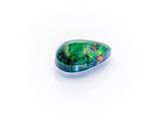 a green oplite stone on a white background