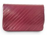 a close up of a red purse on a white background