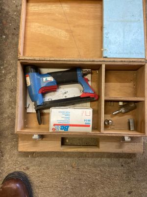 a box with tools inside of it on the floor