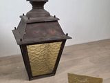 a lamp that is on the floor next to a box