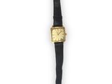 an image of a gold plated wrist watch with a black leather strap