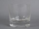 a glass of water sitting on a table