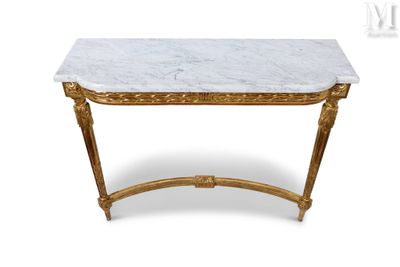a white marble topped console table with gold leaf legs