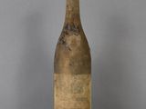 a bottle of wine that is sitting on a table